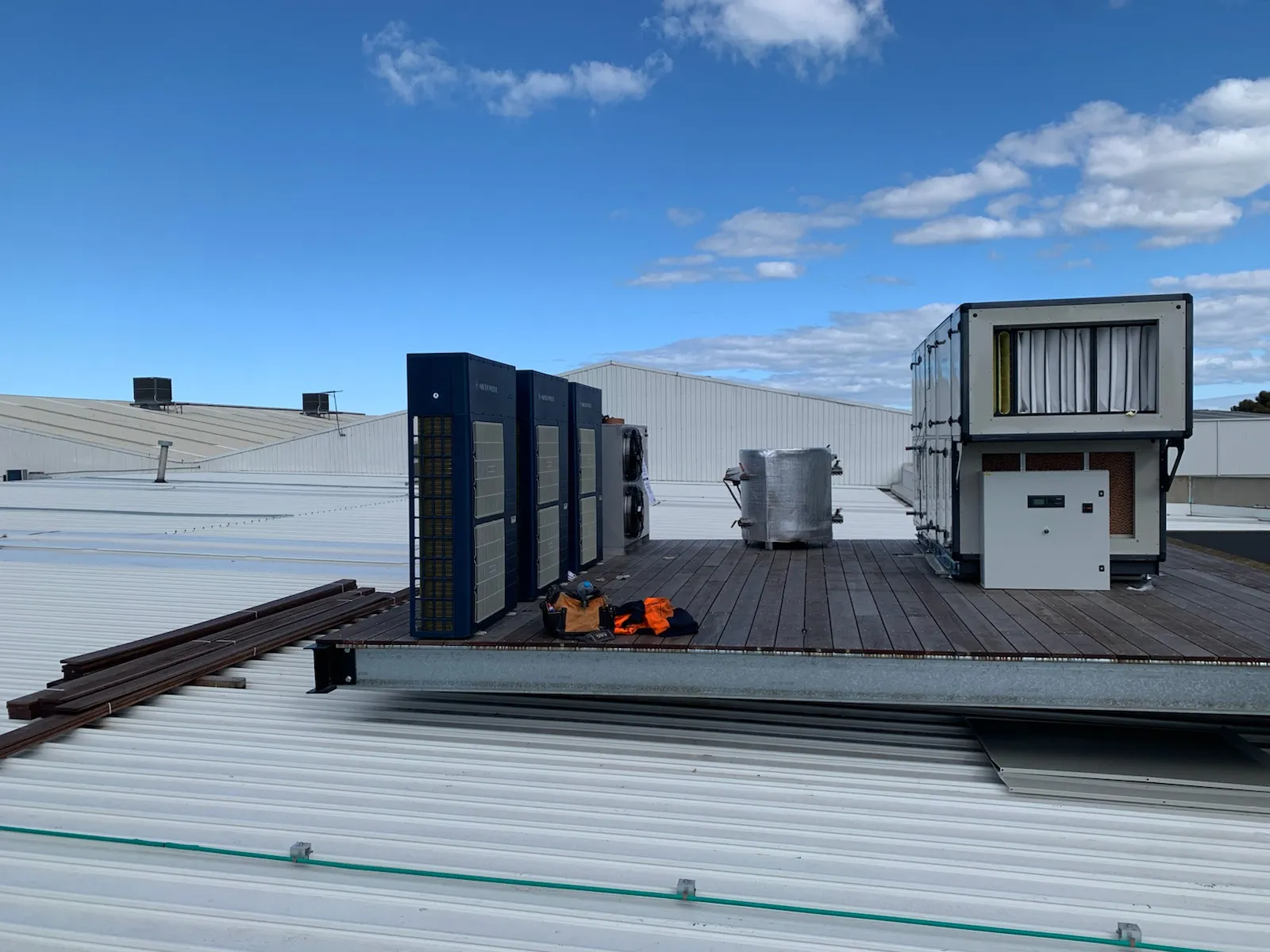 Rooftop packaged dehumidification unit and switchboard on a steel plant deck