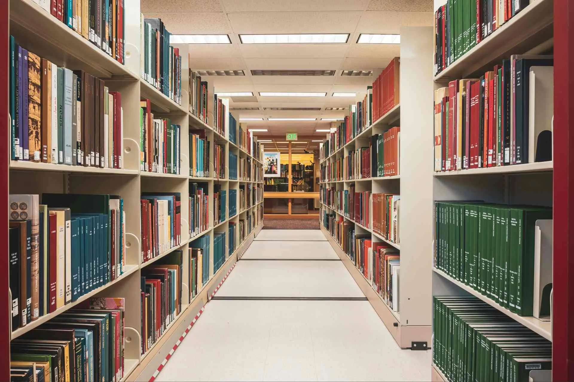 Library aisle lined with bookshelves
