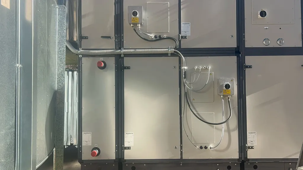 Bank of packaged dehumidification unit sections with access panels