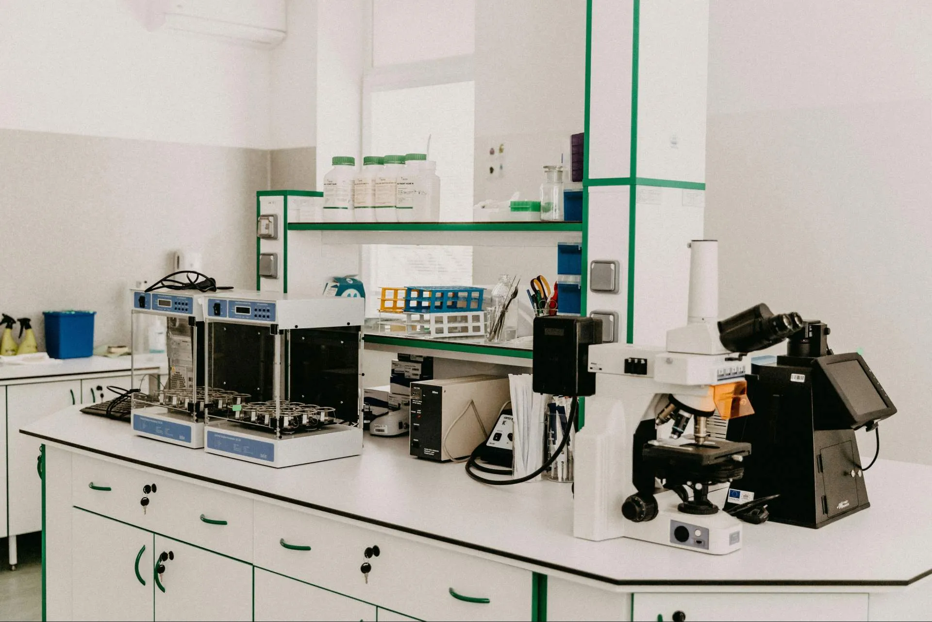 Laboratory bench with microscopes and analytical equipment