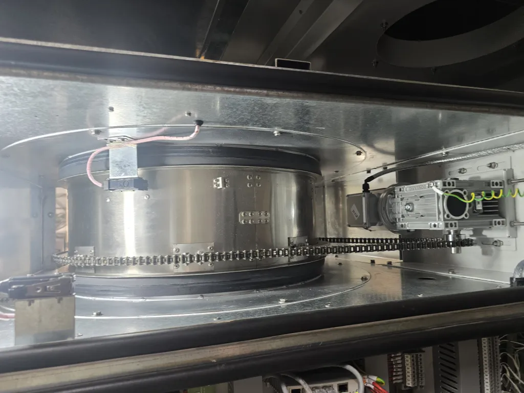 Desiccant rotor and drive belt inside a dehumidification unit during inspection