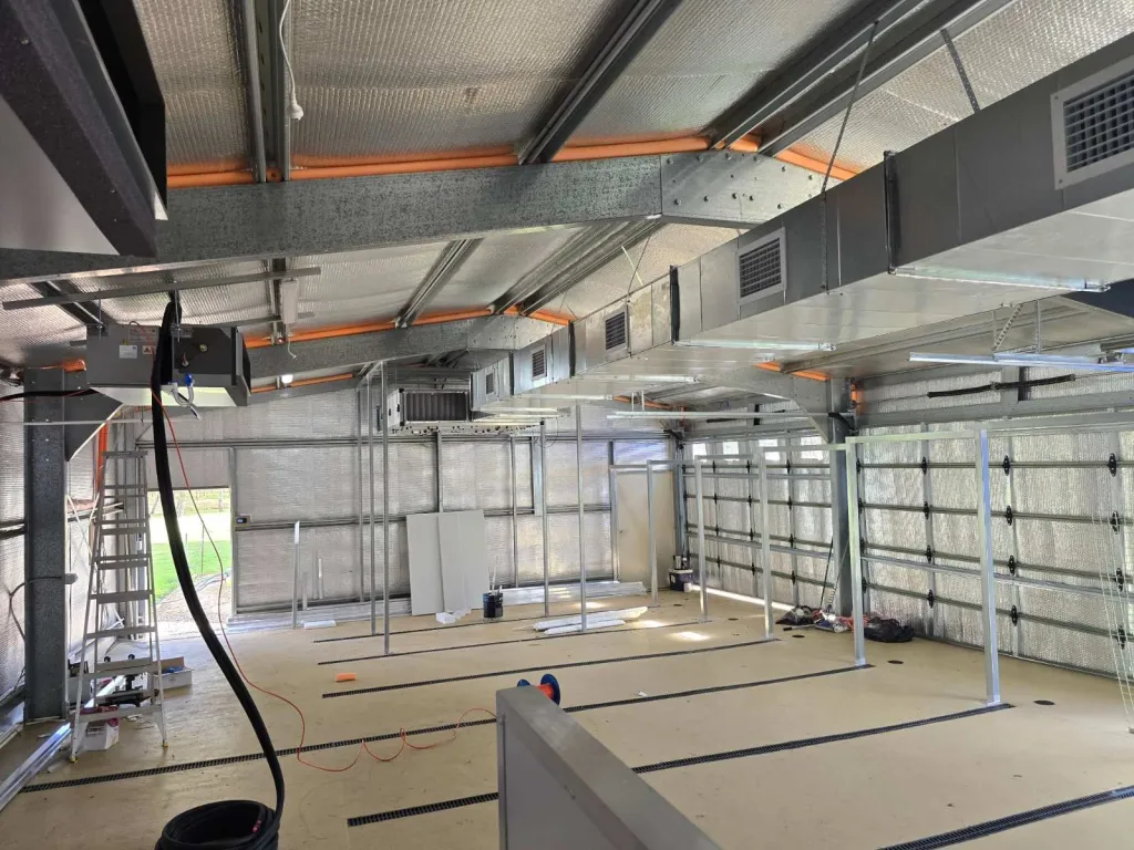 Ductwork installed under the roof of a new dog kennel building
